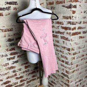 Pink distressed skinny jeans.